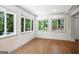 Bright living room featuring hardwood floors and large windows overlooking a green landscape at 2676 Cottonwood Dr, Marietta, GA 30066