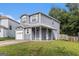 Inviting two-story home with a covered porch and well-maintained lawn in a suburban setting at 4706 Cedar Park Trl, Stone Mountain, GA 30083