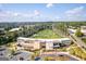 Aerial view of the modern entertainment facility with a driving range, a multi-story building, and ample parking at 1271 Mackintosh Nw Park # 30, Atlanta, GA 30318