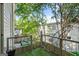 A spacious balcony with green artificial turf and views of surrounding greenery at 1271 Mackintosh Nw Park # 30, Atlanta, GA 30318