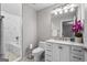 Well-lit bathroom features a marble countertop vanity and shower-tub combination at 1271 Mackintosh Nw Park # 30, Atlanta, GA 30318