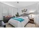 Bedroom with a large window, a bed with a teal blanket and a grey dresser at 1271 Mackintosh Nw Park # 30, Atlanta, GA 30318