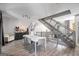 Open-concept living space featuring a modern dining area and staircase at 1271 Mackintosh Nw Park # 30, Atlanta, GA 30318
