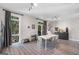 Bright dining area features a modern table, stylish decor, and large windows for abundant natural light at 1271 Mackintosh Nw Park # 30, Atlanta, GA 30318