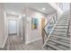 Bright foyer with hardwood floors, staircase, and closet at 1271 Mackintosh Nw Park # 30, Atlanta, GA 30318