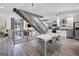 Open-concept living space featuring an industrial staircase, dining area and a modern kitchen with stainless steel appliances at 1271 Mackintosh Nw Park # 30, Atlanta, GA 30318
