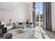 Bright living room featuring high ceilings, expansive windows, and contemporary furnishings at 1271 Mackintosh Nw Park # 30, Atlanta, GA 30318