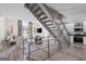 View of open-concept living space featuring an industrial staircase and modern finishes at 1271 Mackintosh Nw Park # 30, Atlanta, GA 30318