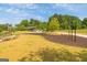 Park workout equipment features shade trees, play equipment, sidewalks, and green space at 1271 Mackintosh Nw Park # 30, Atlanta, GA 30318