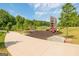 Park playground features shade trees, playground equipment, and sidewalks at 1271 Mackintosh Nw Park # 30, Atlanta, GA 30318
