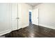 Bedroom featuring hardwood floors, white walls, and a closet for storage at 1914 North Nw Ave, Atlanta, GA 30318