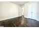 Bedroom featuring hardwood floors, white walls, and a closet for storage at 1914 North Nw Ave, Atlanta, GA 30318