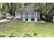 Charming blue two-story home with a well-maintained lawn and a convenient driveway leading to the property at 1914 North Nw Ave, Atlanta, GA 30318