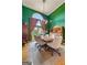 Bright and airy dining area with a large wooden table and green painted walls at 264 Line Creek Cir, Sharpsburg, GA 30277