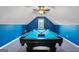Finished game room with bright blue walls, pool table, and ceiling fan at 264 Line Creek Cir, Sharpsburg, GA 30277