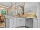 This is a kitchen with white cabinets, granite countertops, stainless steel appliances and tile backsplash at 264 Line Creek Cir, Sharpsburg, GA 30277