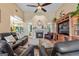Inviting living room featuring a fireplace, high ceilings, and comfortable seating at 264 Line Creek Cir, Sharpsburg, GA 30277