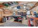 Spacious outbuilding interior with exposed beams, ample workspace and shelving at 264 Line Creek Cir, Sharpsburg, GA 30277