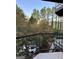 Scenic balcony view overlooking lush greenery, trees, and a glimpse of the surrounding neighborhood at 2840 Peachtree Road Nw Nw Rd # 306, Atlanta, GA 30305