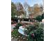 Scenic landscape featuring a fountain, vibrant roses, and blossoming flowers at 2840 Peachtree Road Nw Nw Rd # 306, Atlanta, GA 30305