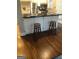 Open-concept kitchen with a central island, barstools, and modern appliances at 2840 Peachtree Road Nw Nw Rd # 306, Atlanta, GA 30305