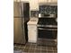 Efficient kitchen featuring stainless steel appliances and decorative backsplash at 2840 Peachtree Road Nw Nw Rd # 306, Atlanta, GA 30305