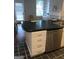 Kitchen with island featuring drawers, cabinets, and stainless steel dishwasher at 2840 Peachtree Road Nw Nw Rd # 306, Atlanta, GA 30305