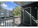 A balcony view overlooking the apartment complex parking lot at 5207 Santa Fe Pkwy, Sandy Springs, GA 30350