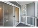 View of the covered outdoor balcony and sliding glass doors at 5207 Santa Fe Pkwy, Sandy Springs, GA 30350