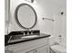 Stylish bathroom features a granite vanity countertop and tile surround tub at 5207 Santa Fe Pkwy, Sandy Springs, GA 30350