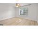 Bright bedroom with hardwood floors, ceiling fan and a large window at 5207 Santa Fe Pkwy, Sandy Springs, GA 30350