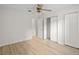 Spacious bedroom featuring hardwood floors, ceiling fan, and closets at 5207 Santa Fe Pkwy, Sandy Springs, GA 30350