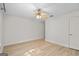 Spacious bedroom featuring hardwood floors, ceiling fan, and bright natural light at 5207 Santa Fe Pkwy, Sandy Springs, GA 30350