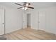 Spacious bedroom featuring hardwood floors, ceiling fan, and bright natural light at 5207 Santa Fe Pkwy, Sandy Springs, GA 30350