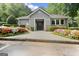 Charming community center with colorful flowers and manicured landscaping at 5207 Santa Fe Pkwy, Sandy Springs, GA 30350