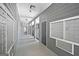 Long well lit hallway with mailboxes for all of the residents to use, in a modern gray colored building at 5207 Santa Fe Pkwy, Sandy Springs, GA 30350