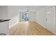 Spacious, light-filled living room with luxury vinyl flooring and sliding glass doors to a patio at 5207 Santa Fe Pkwy, Sandy Springs, GA 30350