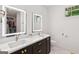 Modern bathroom with dual sinks, elegant fixtures, and lighted mirrors at 698 Eustace Se St, Atlanta, GA 30315