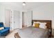 Cozy bedroom with white walls, minimalist decor, and an inviting chair, creating a serene living space at 698 Eustace Se St, Atlanta, GA 30315