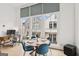 Bright dining area features large windows, modern lighting, and stylish furnishings at 698 Eustace Se St, Atlanta, GA 30315