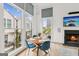 Cozy dining area with fireplace, natural light, and nearby seating area at 698 Eustace Se St, Atlanta, GA 30315