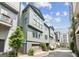 Modern gray townhome featuring a two-car garage and clean, contemporary lines on a well-maintained street at 698 Eustace Se St, Atlanta, GA 30315