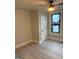 Bright bedroom featuring vinyl floors, neutral walls, updated ceiling fan, and window at 1053 Metropolitan Parkway Southwest Sw Pkwy, Atlanta, GA 30310