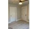 Light-filled bedroom featuring neutral paint, modern ceiling fan, and light wood flooring at 1053 Metropolitan Parkway Southwest Sw Pkwy, Atlanta, GA 30310