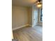 Neutral bedroom features light vinyl floors, white door, and a ceiling fan with lighting at 1053 Metropolitan Parkway Southwest Sw Pkwy, Atlanta, GA 30310