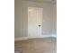 Bedroom with closed door, neutral paint, and light-colored flooring at 1053 Metropolitan Parkway Southwest Sw Pkwy, Atlanta, GA 30310