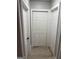 Hallway with fresh paint, light wood-look flooring, and bifold doors at 1053 Metropolitan Parkway Southwest Sw Pkwy, Atlanta, GA 30310