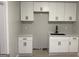 Newly renovated kitchen featuring white cabinets and modern fixtures, all on top of beautiful light wood flooring at 1053 Metropolitan Parkway Southwest Sw Pkwy, Atlanta, GA 30310