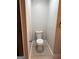 Compact powder room with a sleek, modern toilet and grey walls at 1053 Metropolitan Parkway Southwest Sw Pkwy, Atlanta, GA 30310