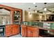 This home features a bar with wood cabinets, a sink, granite countertops, and recessed lighting at 200 Long Needle Ct, Sugar Hill, GA 30518